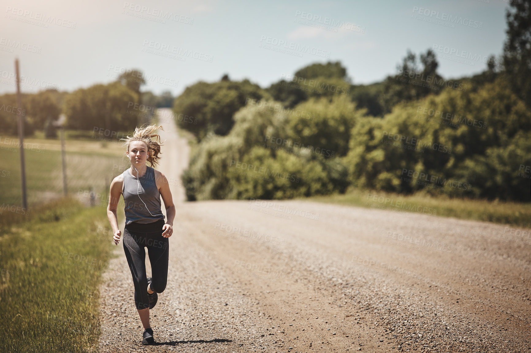 Buy stock photo Portrait of a young woman out on a trail run