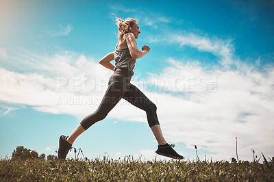 Buy stock photo Music, fitness and happy woman running on grass for healthy body, wellness or exercise to workout. Earphones, cardio and trail runner training in nature for race, marathon and jog for sport outdoor