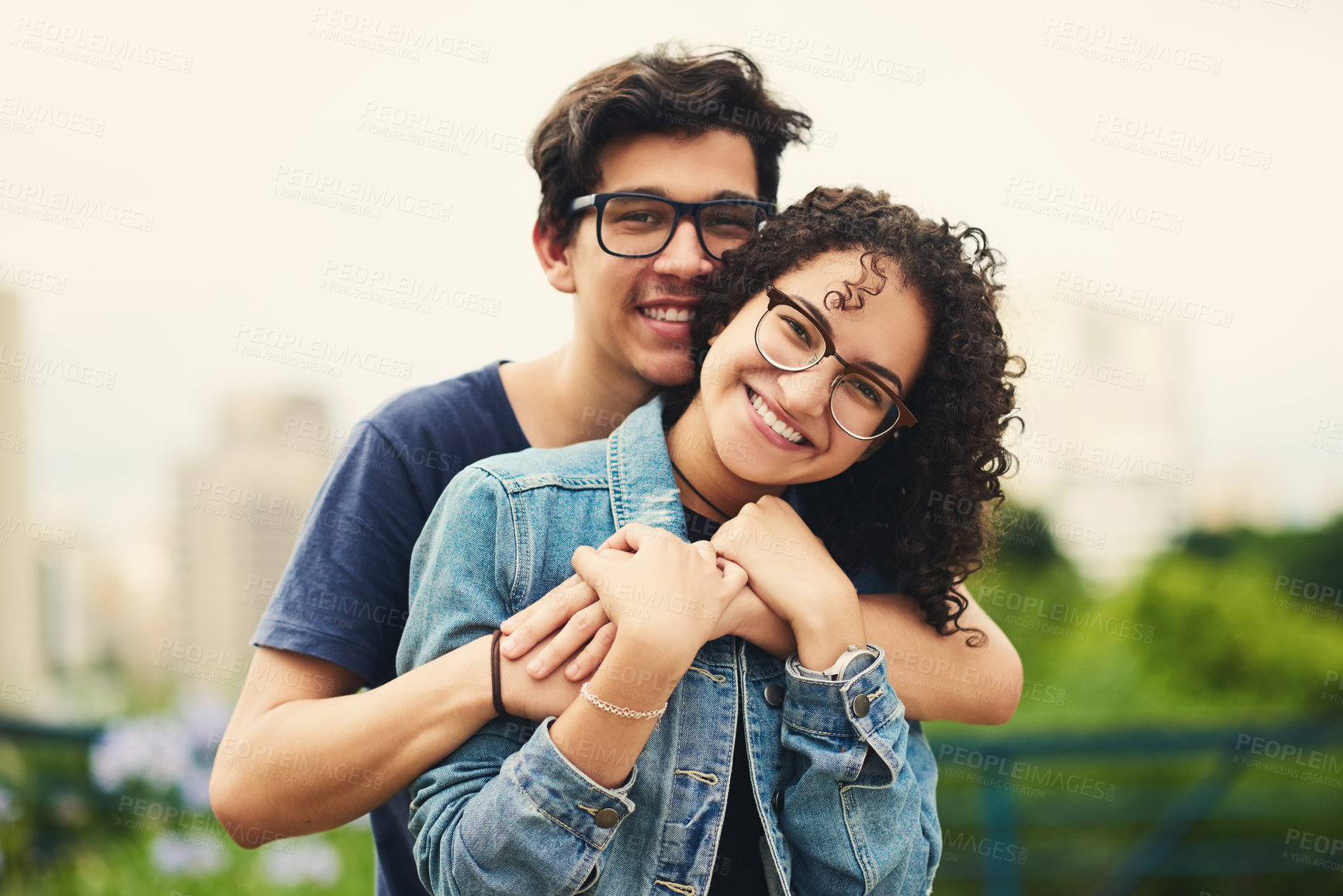 Buy stock photo Couple, teenager and portrait outdoor for romance, bonding and hug on date together on weekend with relax. Boy, girl and face for relationship support, embrace and happy in park with love connection