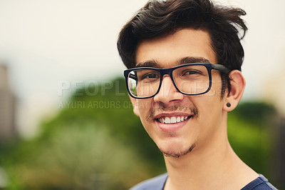 Buy stock photo Outdoor, man and happy on portrait with glasses at park to relax and break Mexico. Male person, teenager and smile or satisfied with confidence for adventure, fun and chill with mindfulness and rest