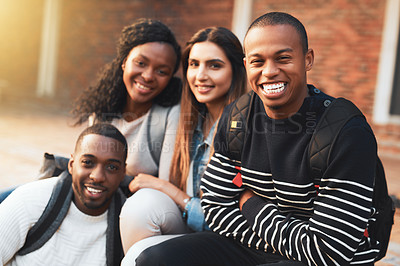 Buy stock photo Portrait of a group of students relaxing together during a break on campus