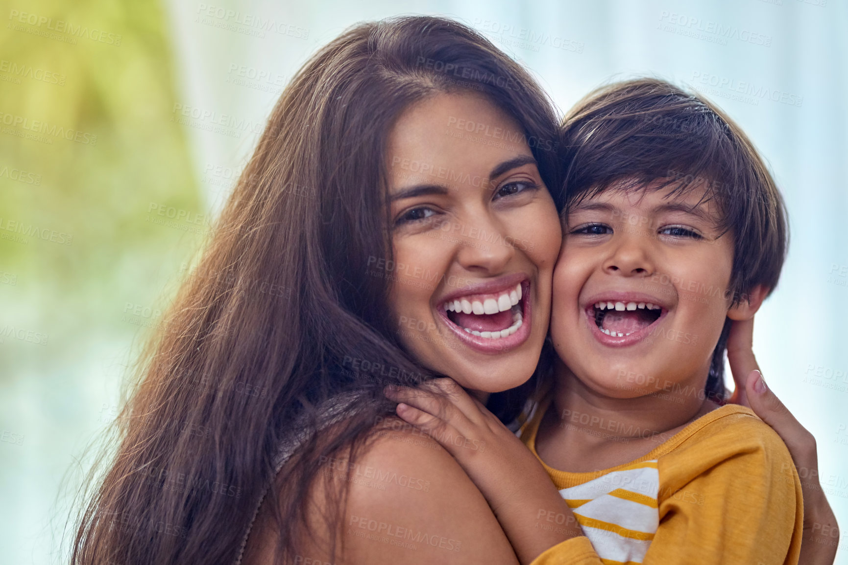 Buy stock photo Hug, happy and portrait of mom with child for bonding, loving relationship and relax together in home. Family, laughing and mother with young boy embrace for love, affection and care in living room