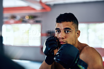 Buy stock photo Gym, man and serious on training with boxing for exercise or workout for competition. Male person, fitness and concentrate with sports or hobby on building muscle for tournament and challenge