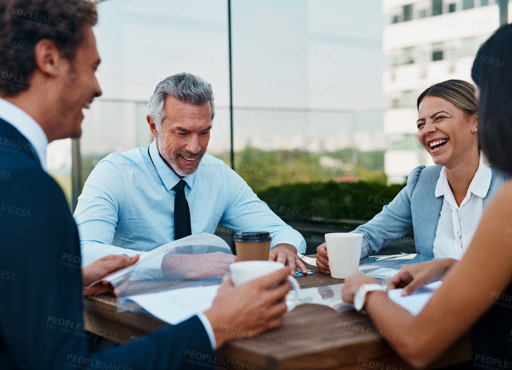 Buy stock photo Cropped shot of corporate businesspeople having a meeting outside