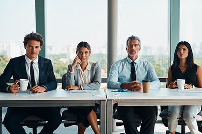 Buy stock photo Cropped shot of corporate businesspeople sitting in a row ready to interview a candidate inside