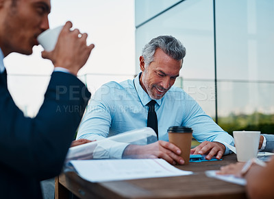 Buy stock photo Cropped shot of corporate businessmen having a meeting outside