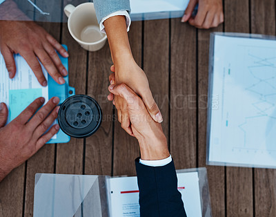 Buy stock photo High angle shot of unrecognizable corporate businesspeople shaking hands outside