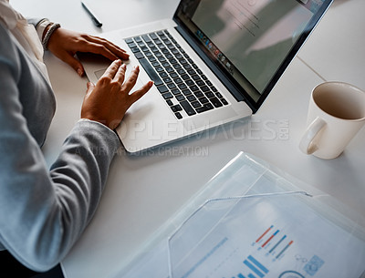 Buy stock photo Cropped shot of an unrecognizable corporate businesswoman using a laptop in the office