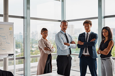 Buy stock photo Cropped shot of corporate businesspeople standing with their arms crossed in the office