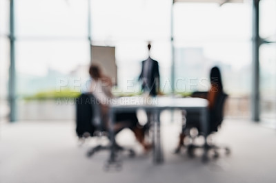 Buy stock photo Blurred shot of corporate businesspeople having a meeting in the boardroom