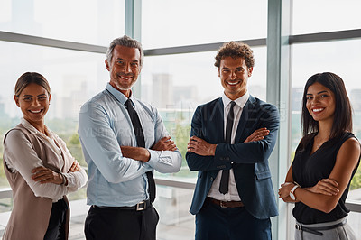 Buy stock photo Cropped shot of corporate businesspeople standing with their arms crossed in the office