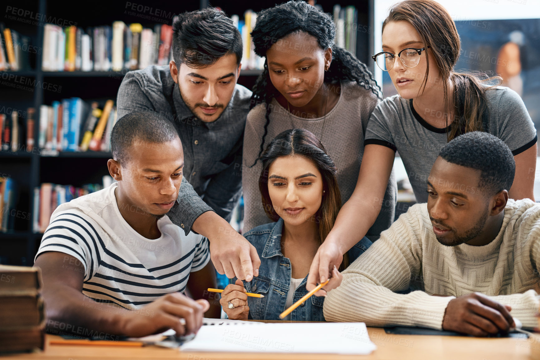 Buy stock photo People, students in library and studying for exam or research for project, education and teamwork. Diversity, young men and women in study group and learning with collaboration on university campus