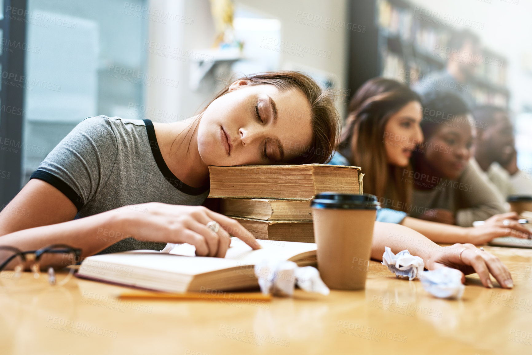 Buy stock photo Woman, sleeping and books for studying at library, college and tired with stress, anxiety or burnout. University student, girl and sleep with education, study and fatigue with notes, school and desk