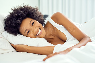 Buy stock photo Home, African woman and wake up in portrait for relaxing, resting and smile at bedroom in morning. Bed, female person and happiness with comfort, chilling and lying for wellness in apartment