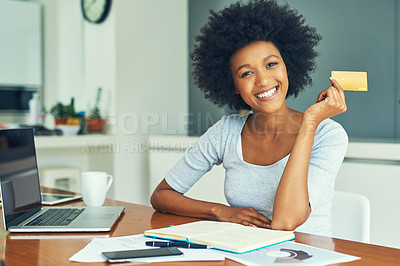 Buy stock photo Cropped portrait of an attractive young businesswoman doing her banking online at home