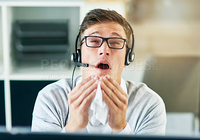 Buy stock photo Man, headset and sneezing in workplace with illness as virtual assistant, communication staff and employee. Male person, sick and unhealthy for technical support, call center and customer service