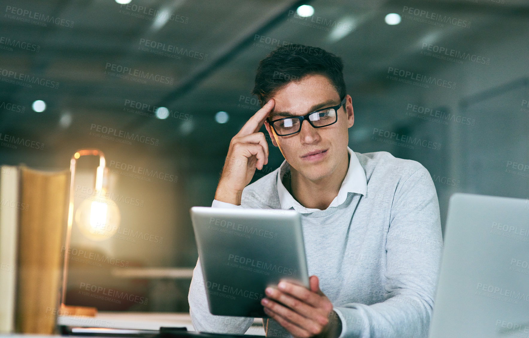 Buy stock photo Business, thinking and man with tablet, night and thoughts with planning for project ideas. Person, employee and consultant with tech, solution and choice for review, feedback and problem solving