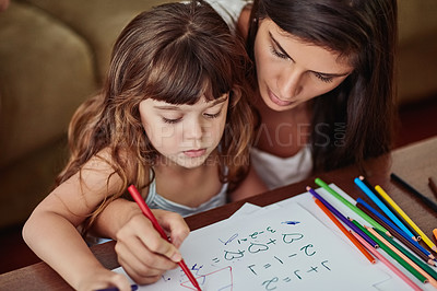 Buy stock photo Shot of a young woman drawing together with her young daughter at home