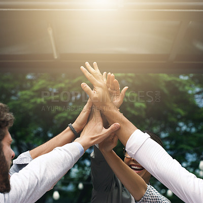 Buy stock photo Shot of a group of businesspeople high fiving outdoors