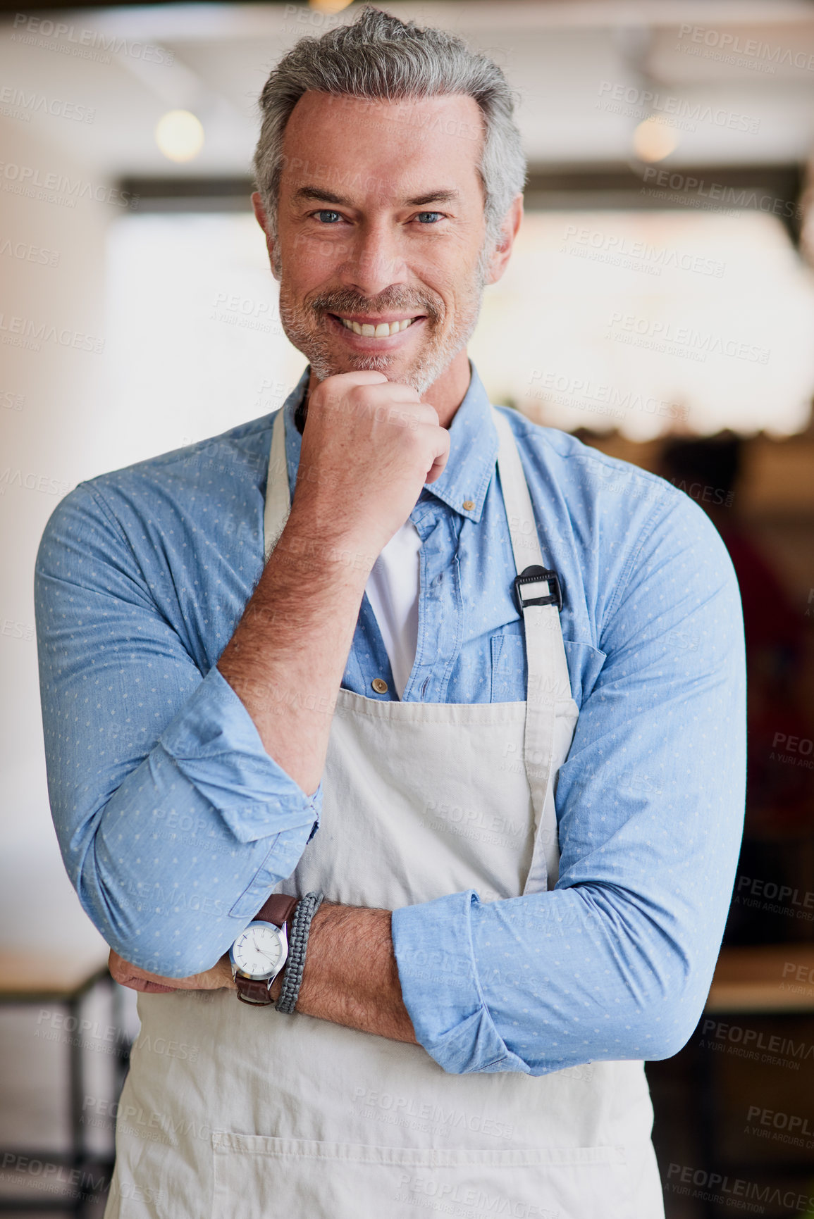 Buy stock photo Portrait of a confident mature man working in a coffee shop