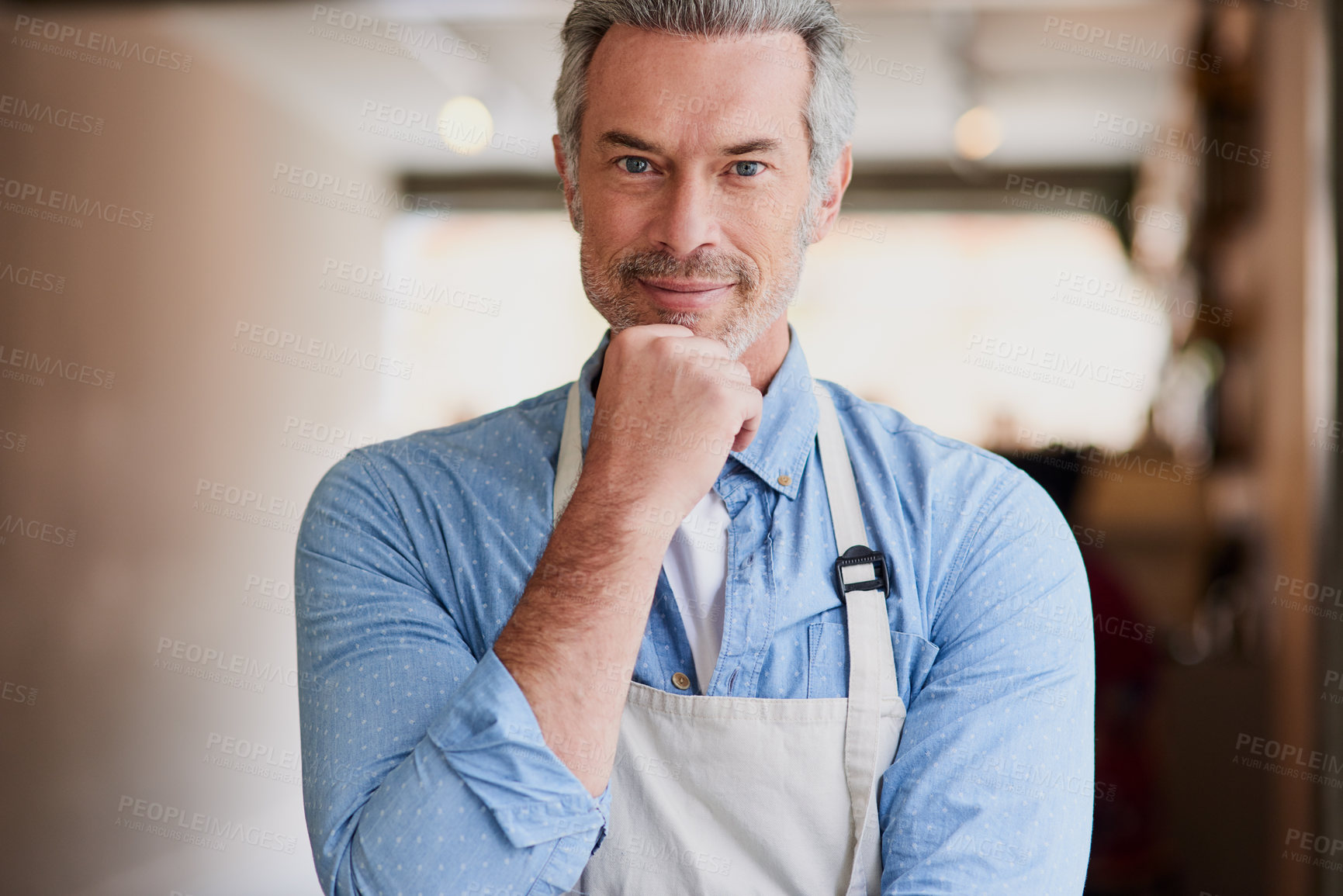 Buy stock photo Portrait of a confident mature man working in a coffee shop