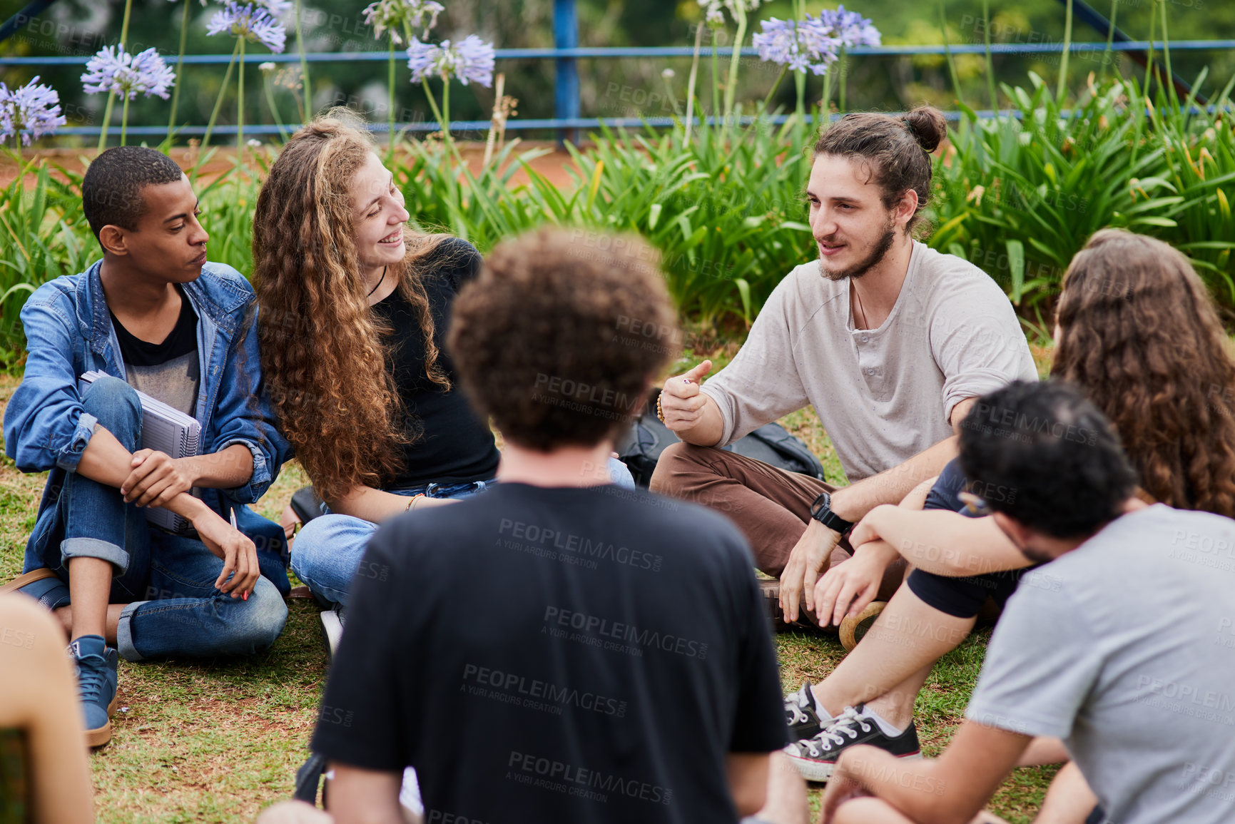 Buy stock photo Students, group and talking outdoor of college, learning or study tips, advice and support on campus for orientation. Friends or young people in circle with help for education and sharing knowledge