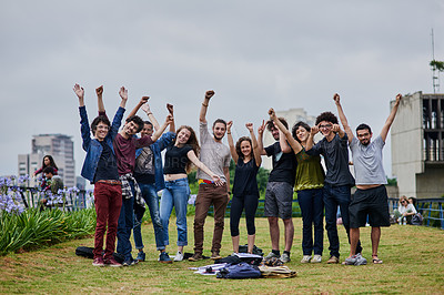 Buy stock photo Portrait of a group of young students jumping with joy in the air outside in a park during the day