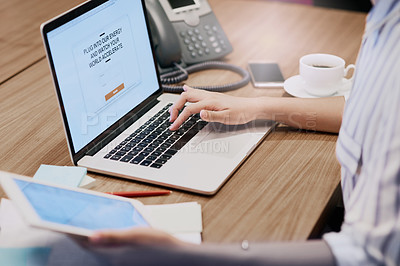 Buy stock photo Closeup shot of an unrecognizable businesswoman working on a laptop in an office