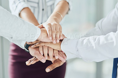 Buy stock photo Closeup shot of a group of unrecognizable businesspeople joining their hands together in unity