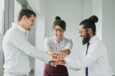 Buy stock photo Shot of a group of businesspeople joining their hands together in unity