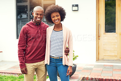 Buy stock photo Portrait of a young couple standing outside their house