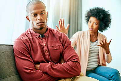 Buy stock photo Man, portrait and argument with woman on sofa with arms crossed for stress, frustrated or divorce in home. African couple, angry and fight with shouting, questions or conflict for cheating in house