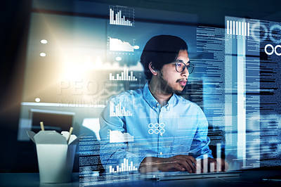 Buy stock photo Shot of a focused young programmer working on his computer in the office during the night