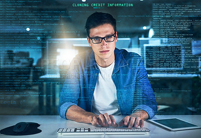 Buy stock photo Portrait of a focused young programmer working on his computer in the office during the night