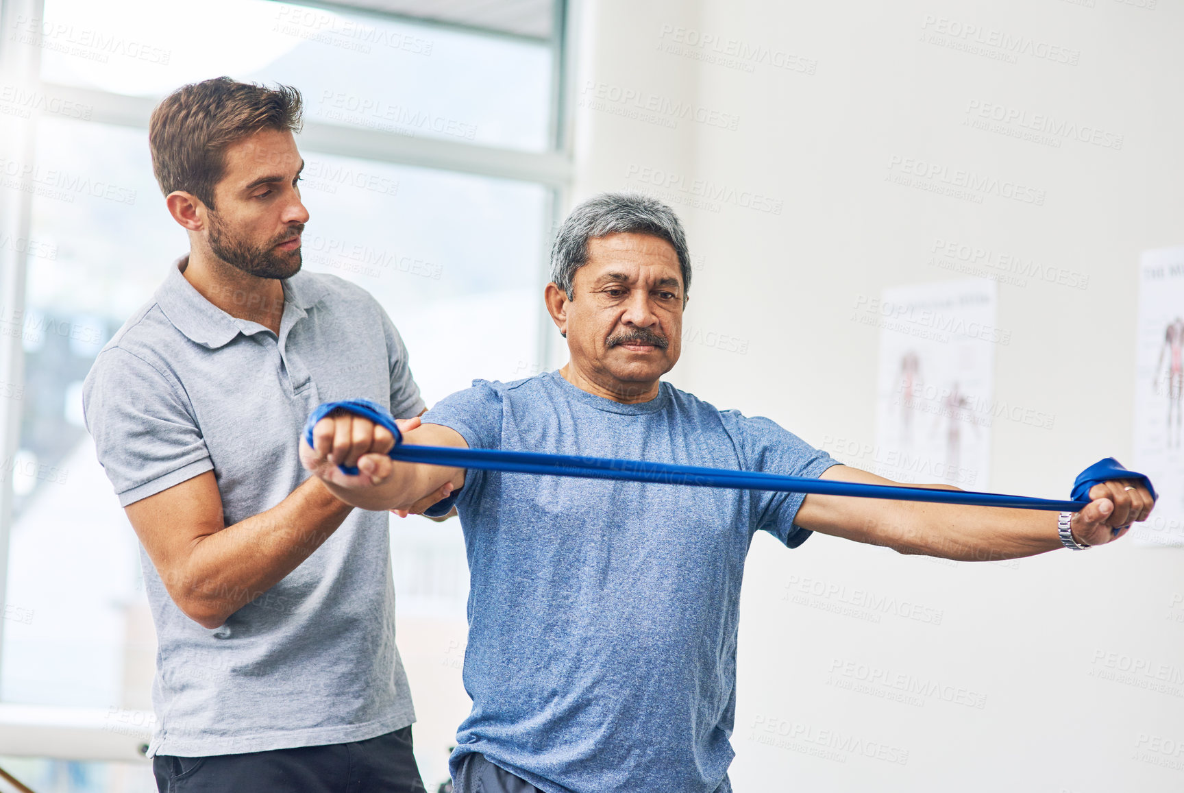 Buy stock photo Physiotherapist, senior man and stretching for strong muscle, elderly care and wellness for fitness. Pensioner, male person and exercise band for activity, rehabilitation clinic or hospital as medic