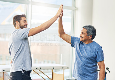 Buy stock photo Physiotherapist, senior man and high five for support, elderly care and wellness for health or fitness. Pensioner, male person and medic for appointment, rehabilitation clinic or retirement home