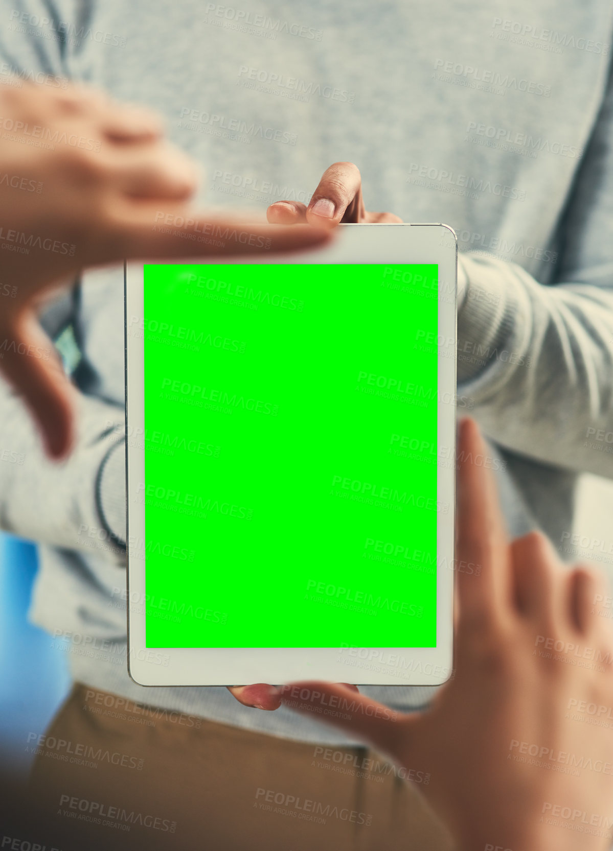 Buy stock photo Cropped shot of two unrecognizable businessmen framing a digital tablet with a green screen