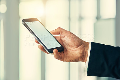 Buy stock photo Cropped shot of corporate businessmen texting on a cellphone