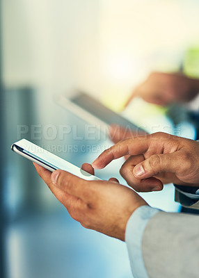 Buy stock photo Cropped shot of corporate businessmen using their mobile phones