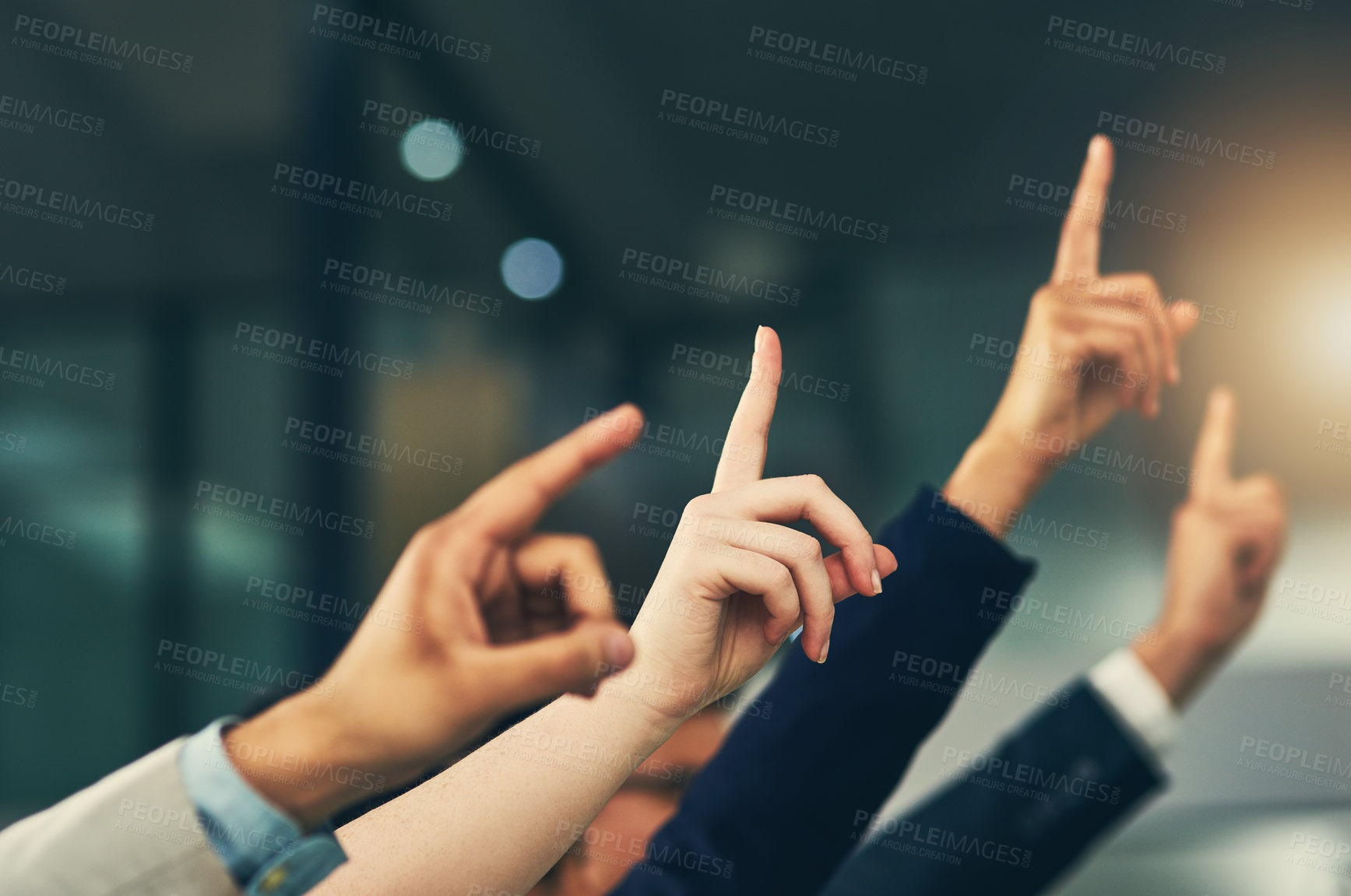 Buy stock photo Cropped shot of a group of businesspeople raising their hands