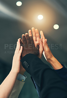 Buy stock photo Cropped shot of a group of businesspeople joining their hands in solidarity