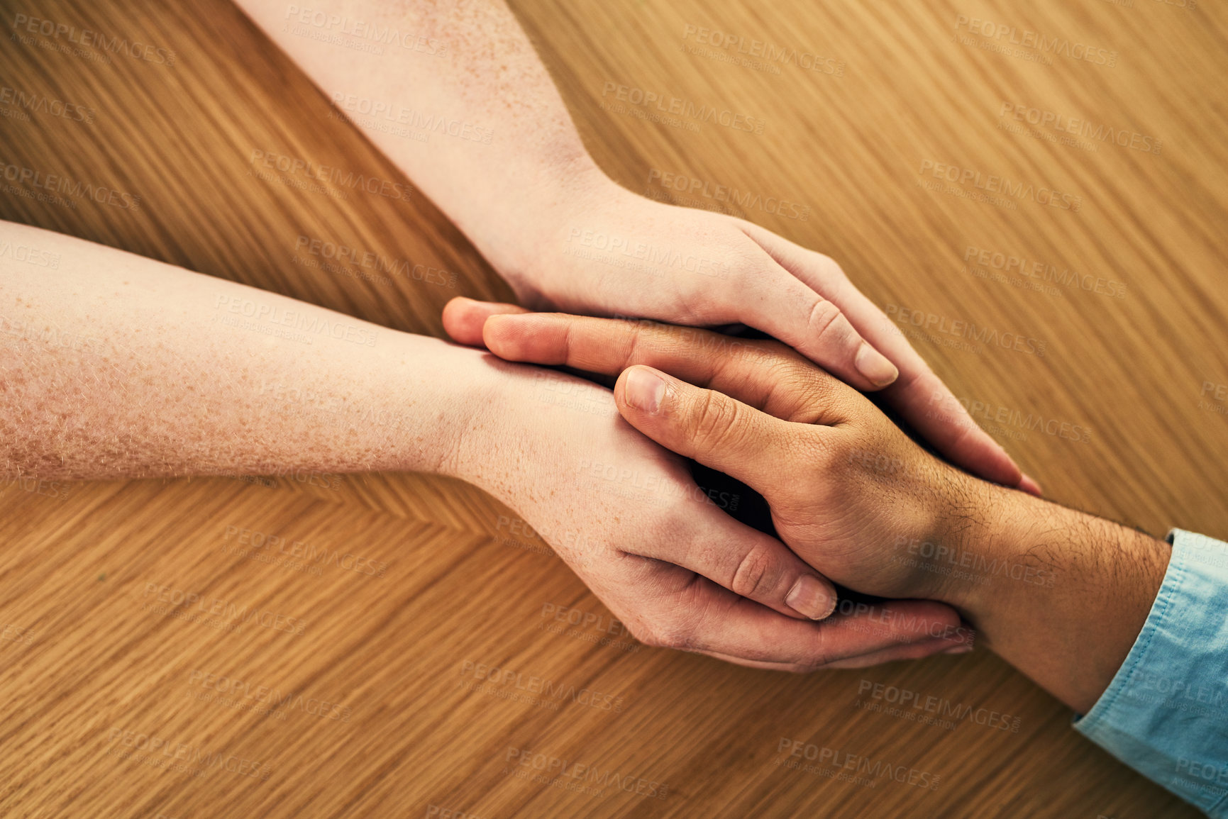 Buy stock photo Trust, above and couple holding hands on table for emphathy, understanding and kindness at home. People, marriage and love with comfort in partnership for commitment, connection and compassion
