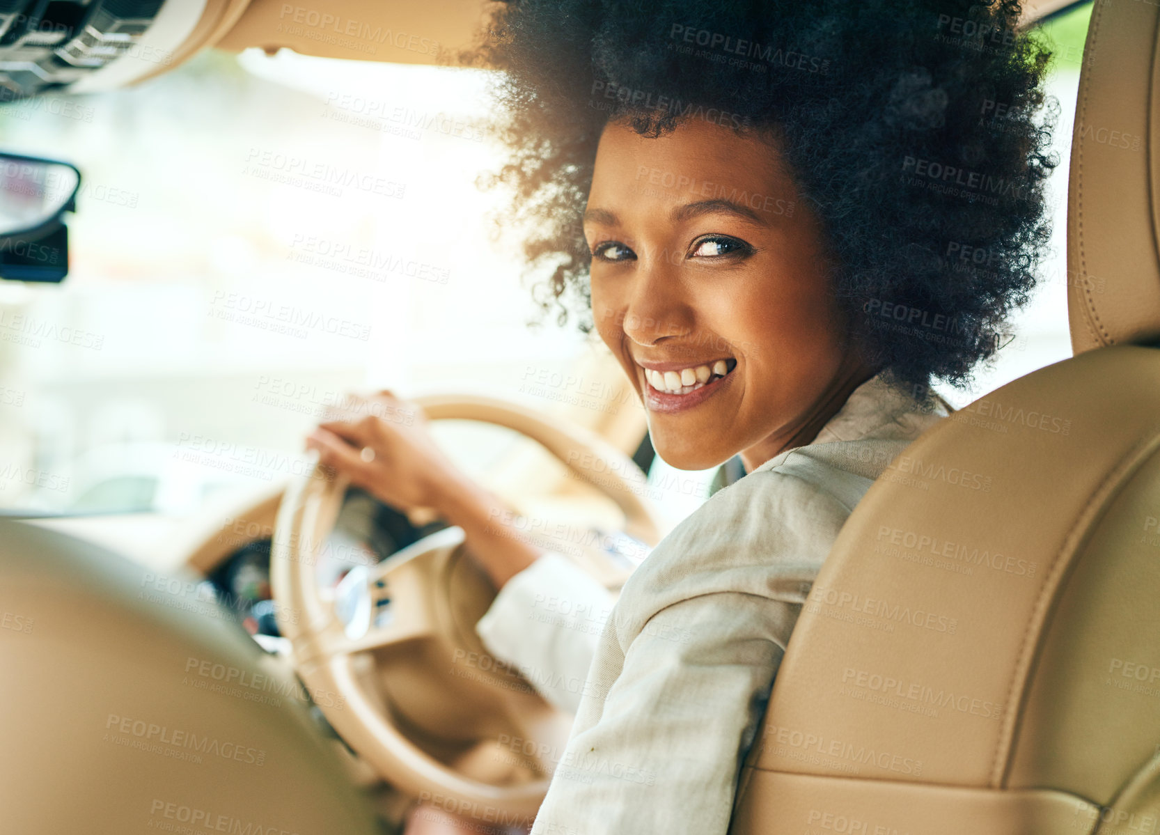 Buy stock photo Portrait of a cheerful young businesswoman driving in a car on her way to work during the day