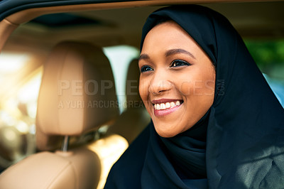 Buy stock photo Shot of a cheerful young businesswoman getting out of a car to get to work during the day