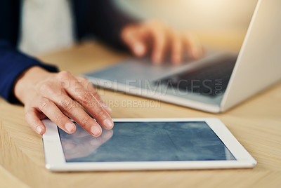 Buy stock photo Closeup shot of an unrecognizable businesswoman working on a laptop and digital tablet in an office