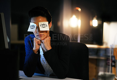 Buy stock photo Shot of a young businesswoman working late in an office with adhesive notes covering her eyes