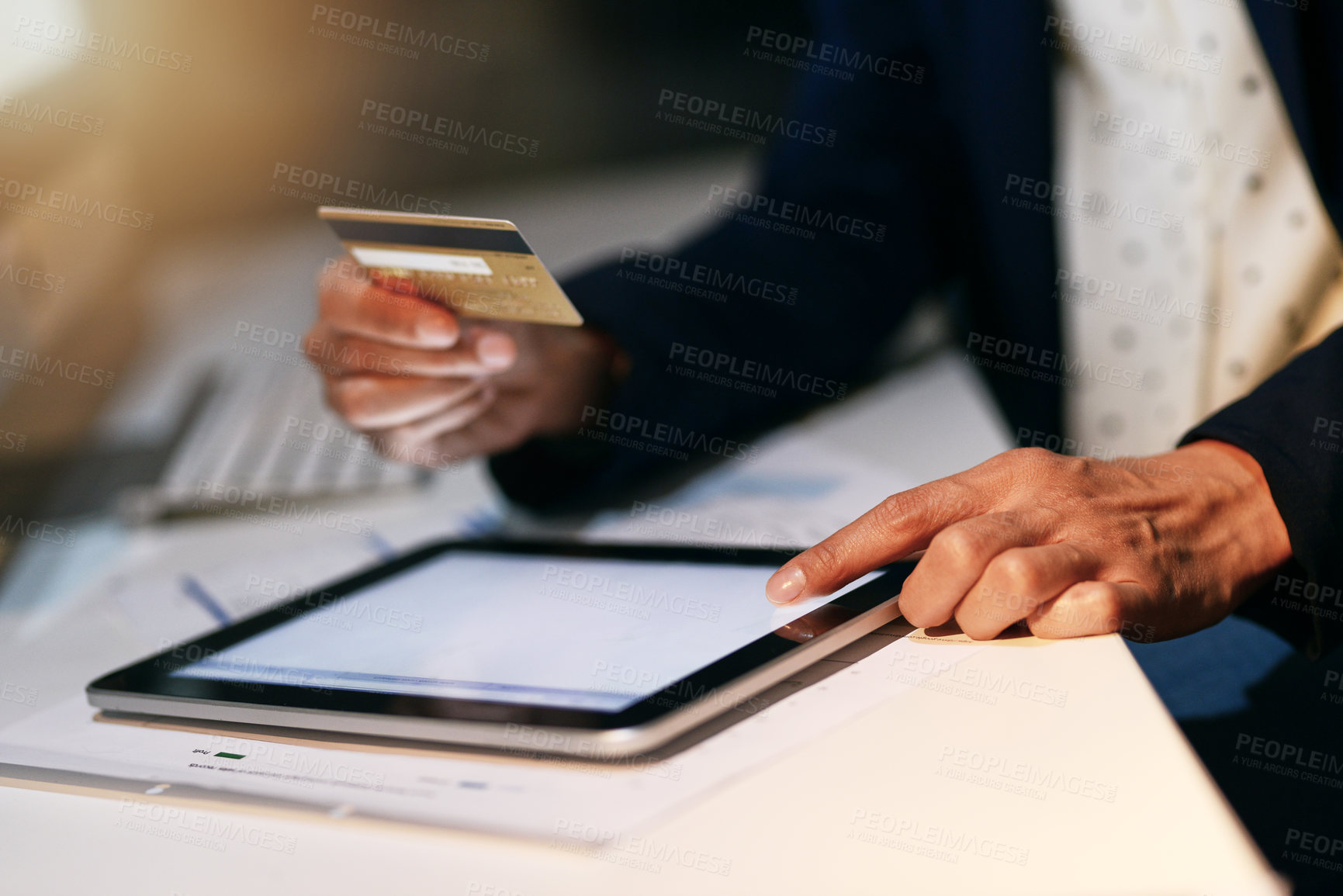 Buy stock photo Closeup shot of an unrecognizable businesswoman making an online purchase using a credit card and digital tablet at the office