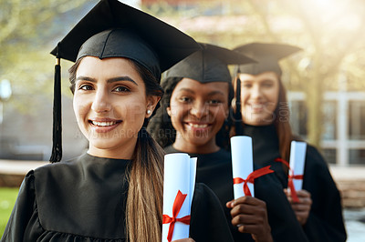 Buy stock photo Portrait of a group of young women holding their diplomas on graduation day
