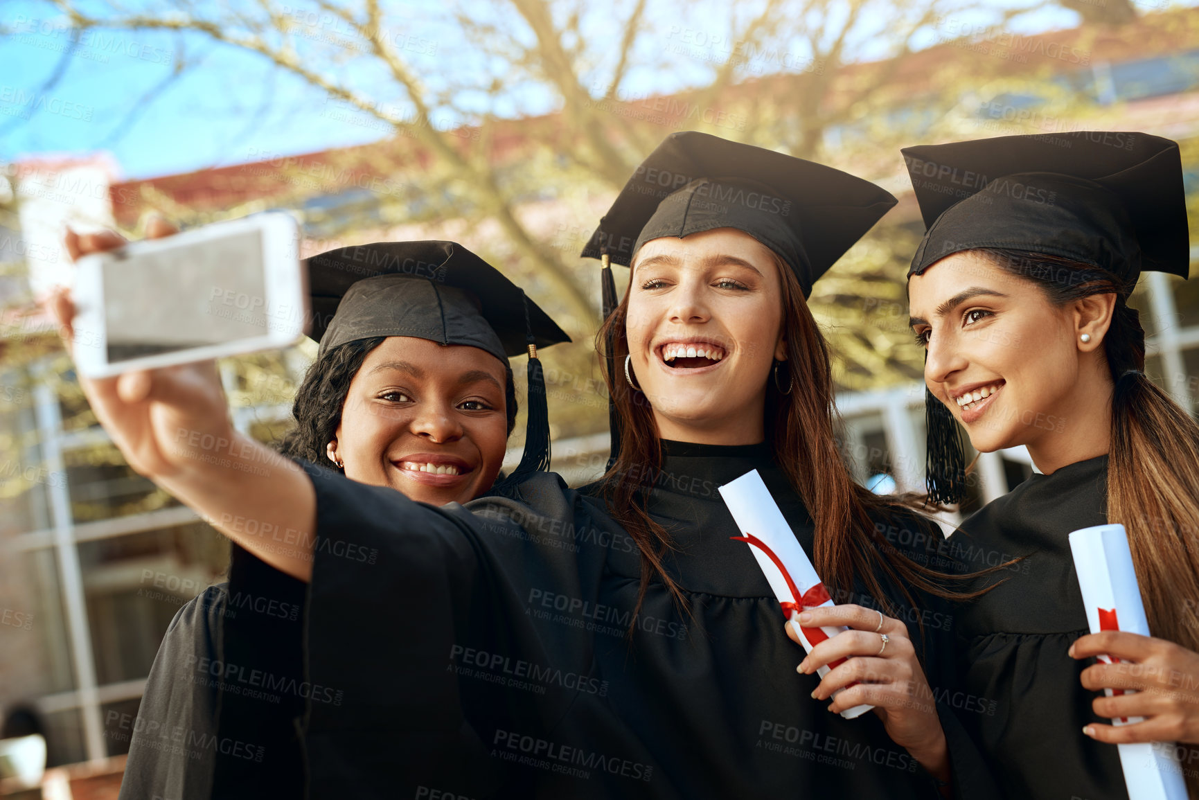 Buy stock photo Students, graduation and happy with selfie on campus for celebration and success. People, college and university classmate or friends with smile for social media post with qualification competition