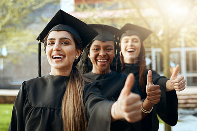 Buy stock photo Portrait of a group of young women showing thumbs up on graduation day